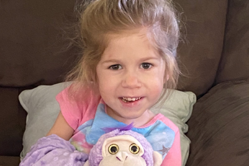 Real spinal muscular atrophy (SMA) Type 1 patient Adalyne smiling and sitting up